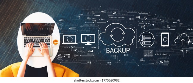 Backup concept with person using a laptop on a white table