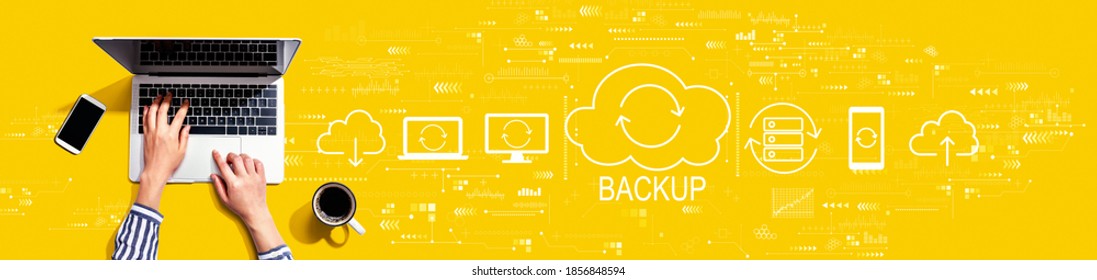 Backup concept with person using a laptop computer - Shutterstock ID 1856848594