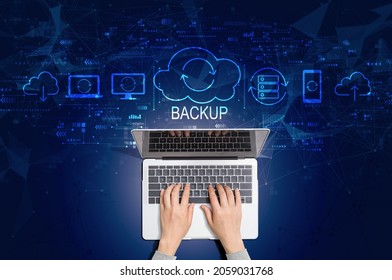 Backup Concept With Person Using A Laptop Computer