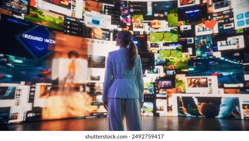 Backview Of Caucasian Woman Looking at Animated Stream Of Content. Visualization Of Browsing Metaverse Big Data with Viral Videos, Social Media Profiles with Influencers, Internet Communities.