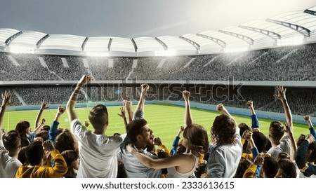 Backview of supporting cheering soccer fans with raising one hand over 3d model of sport stadium. Concept of hobbies, emotions, team games, ad and active lifestyle