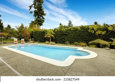 Backyard With Beautiful Swimming Pool, Deck Chairs. Real Estate In Federal Way, WA