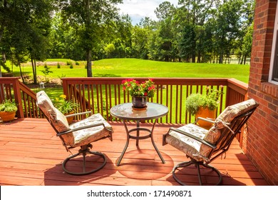 Backyard deck overlooking lake outside residential structure