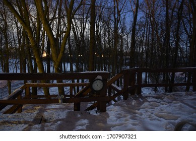 Backyard Deck Porch At Night With Full Moon Light In Backyard Forest Wood In Winter Under A Clear Sky With Snow On The Ground