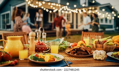 Backyard Dinner Table with Tasty Grilled Barbecue Meat, Fresh Vegetables and Salads. Happy Joyful People Dancing to Music, Celebrating and Having Fun in the Background on House Porch. - Powered by Shutterstock