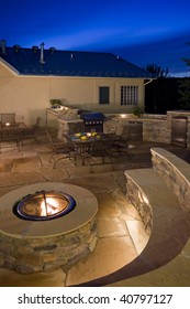 backyard with fire pit, outdoor kitchen  and flagstone patio patio
