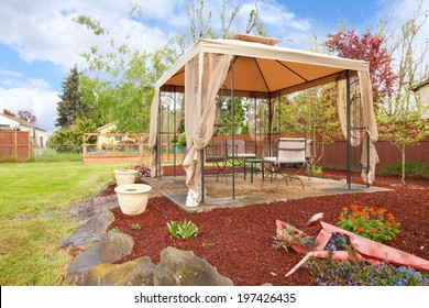 Backyard  With Flower Beds, Lawn And Gazebo