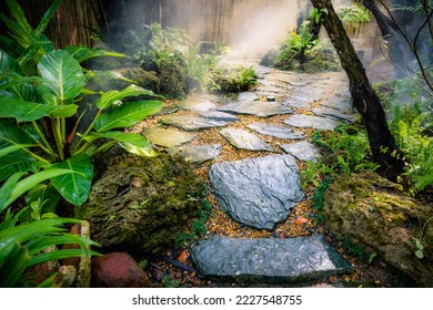 Backyard garden minimal desing with natural stone walkway in green fresh forest sunlight at home. - Shutterstock ID 2227548755
