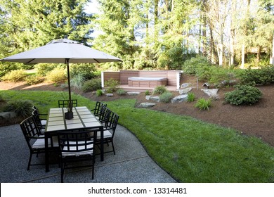 Backyard Of A House With A Patio Set And Jacuzzi