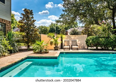 Backyard Oasis With A Swimming Pool Inside A Private Residential Backyard	