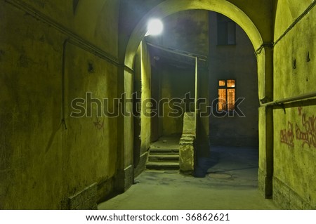 Backyard of old buildings at night