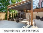 Backyard outdoor bbq zone with pergola, fireplace and hanging chair.