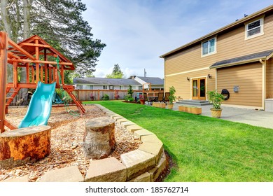 Backyard With Patio Area And Playground For Kids