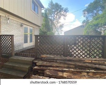 Backyard Patio Porch Repair Wood Shrapnel On A Sunny Day Real Estate Under Construction With Yellow Caution Tape On Door