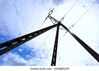 Backyard pole with high voltage power lines , bottom to top view