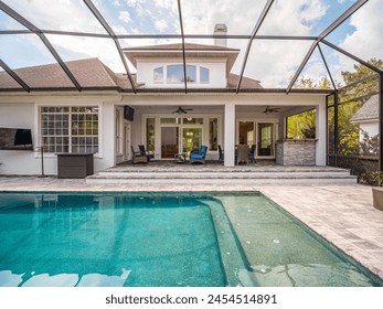 Backyard pool with screen enclosure