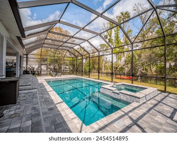 Backyard pool with screen enclosure