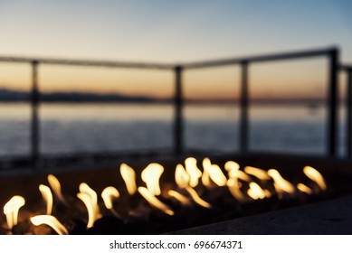 Backyard Seaside Fire Pit At Sunset, Blurred Background Focus