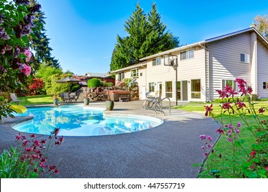 Backyard With Small Beautiful Swimming Pool, Hot Tub, Patio Area, Chairs And Basketball Hoop