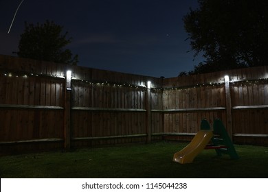 Backyard With Solar Lights At Night