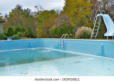 Backyard Swimming Pool With Diving Board Pool Slide And Ladder Emptied Out Shutting Down For Winter