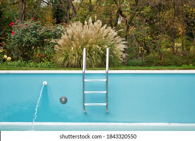 Backyard Swimming Pool With Ladder Emptied Out Shutting Down For Winter