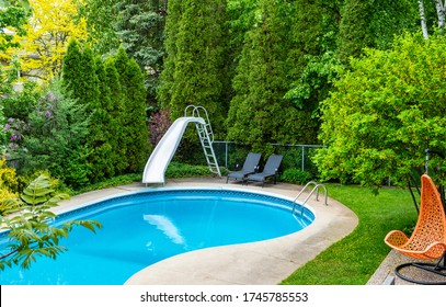 Backyard Swimming Pool With A Water Slide