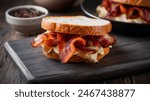 Bacon Butty - Sandwich filled with crispy bacon, often on buttered bread.
