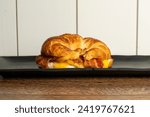 Bacon, egg and cheese on a croissant