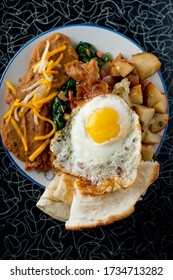 Bacon And Eggs. Bacon, Sausage, Fried Eggs, Potato Hash, Refried Beans And Homemade Corn Tortillas. Classic American Diner Breakfast Or Brunch Favorite.