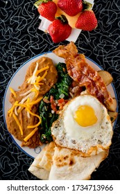 Bacon And Eggs. Bacon, Sausage, Fried Eggs, Potato Hash, Refried Beans And Homemade Corn Tortillas. Classic American Diner Breakfast Or Brunch Favorite.