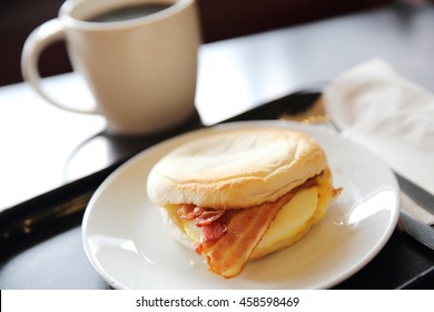 Bacon And Fried Egg Roll With Coffee