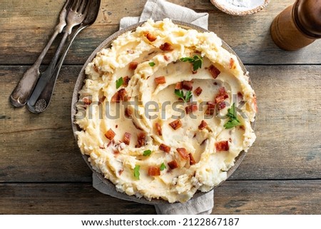 Bacon mashed potatoes with cheddar cheese and fresh parsley