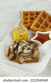 Bacon With Mushroom Gravy Dish With Corn, Waffles And Syrup