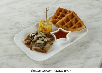 Bacon With Mushroom Gravy Dish With Corn, Waffles And Syrup