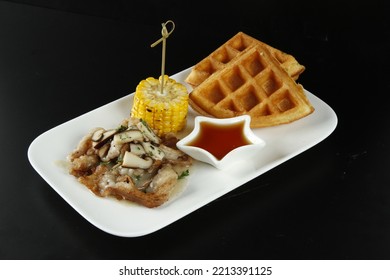 Bacon With Mushroom Gravy Dish With Corn, Waffles And Syrup