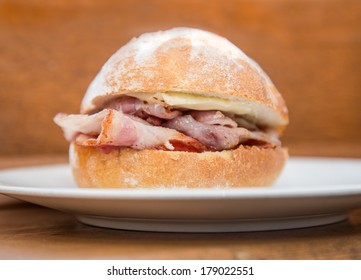 Bacon Roll/bap On A Plate.