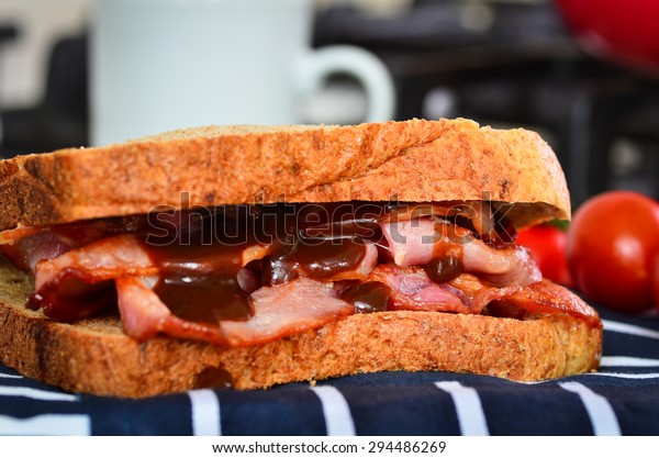 Bacon sandwich with brown\
sauce
