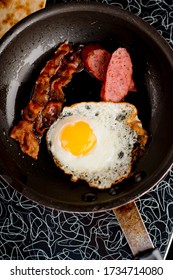 Bacon, Sausage, Fried Eggs, Potato Hash, Refried Beans And Homemade Corn Tortillas. Classic American Diner Breakfast Or Brunch Favorite.