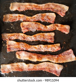 Bacon Sizzling On Skillet