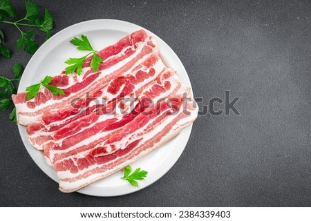 bacon slices fresh meat product pork eating cooking appetizer meal food snack on the table copy space food background rustic top view