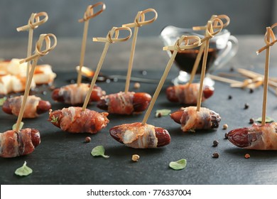 Bacon Wrapped Dates On Table