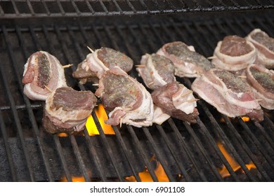 Bacon Wrapped Venison Steaks On The Grill