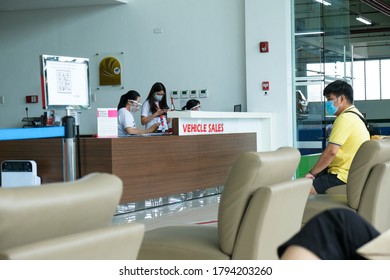 Bacoor, Cavite, Philippines
August 8, 2020
man waits at the lounge area of a car dealership with background of female workers - Shutterstock ID 1794203260
