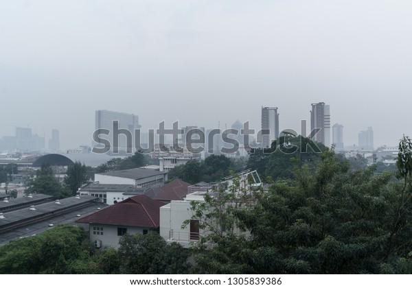 Bad air quality due to PM 2.5 dust\
over standard level in the air around Bangkok\
city.
