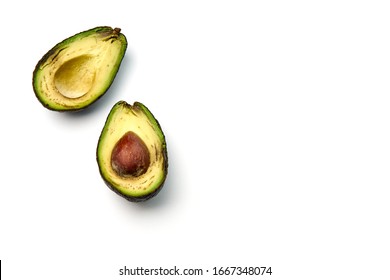 A Bad Avocado Cut In Half On White Background.