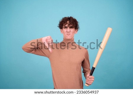 Bad boy posing in studio for halloween.