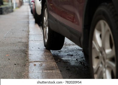 Bad Car Parking With Part Of The Rear Tyre On The Pavement