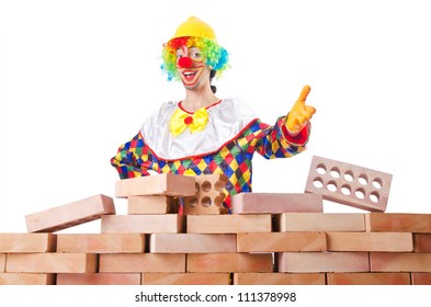 Bad Construction Concept With Clown Laying Bricks