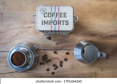 BAD DRIBURG, GERMANY - Feb 22, 2020: A topdown shot of coffee canister surrounded by a Bialetti and some coffee beans